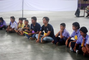 Rean REOUN, Cambodian social worker, left, and Min Eaik Siek Mon, Burmese social worker, right, are pictured here at work with Peuan Peuan.