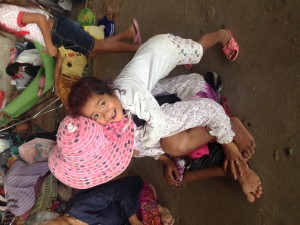 happy in teh face of adversity - over 100 children are at the evacuation center
